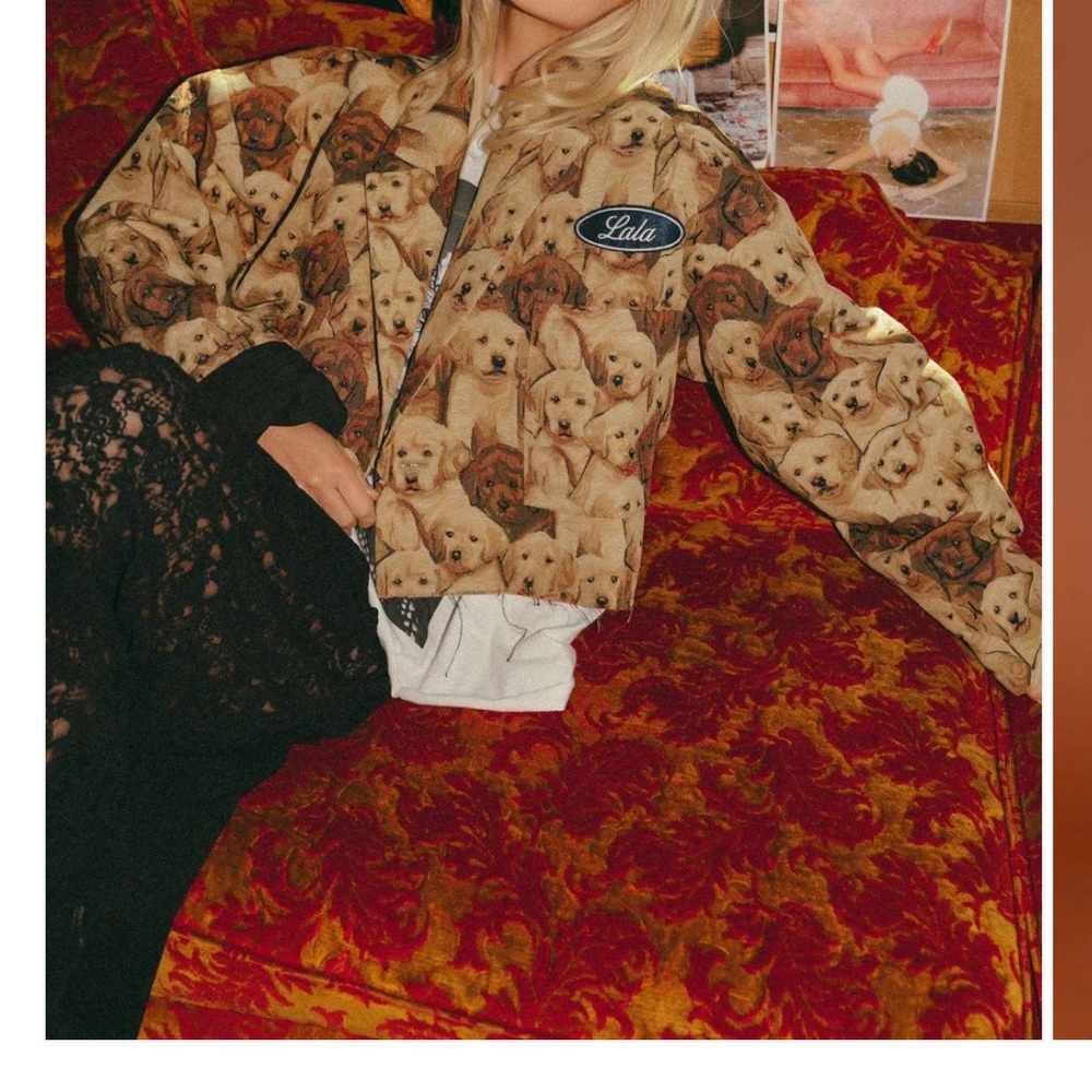 Dressed in LALA Puppy Print Jacket missing LaLa patch